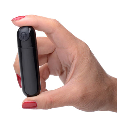 Metallic black bullet vibrator shown held in hand 
