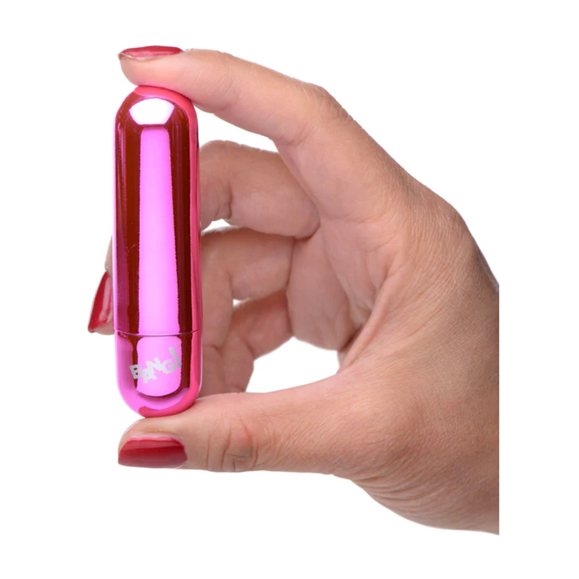 Metallic pink bullet vibrator shown held in hand 