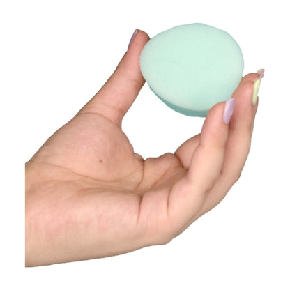 Menstrual sponge held in hand size reference