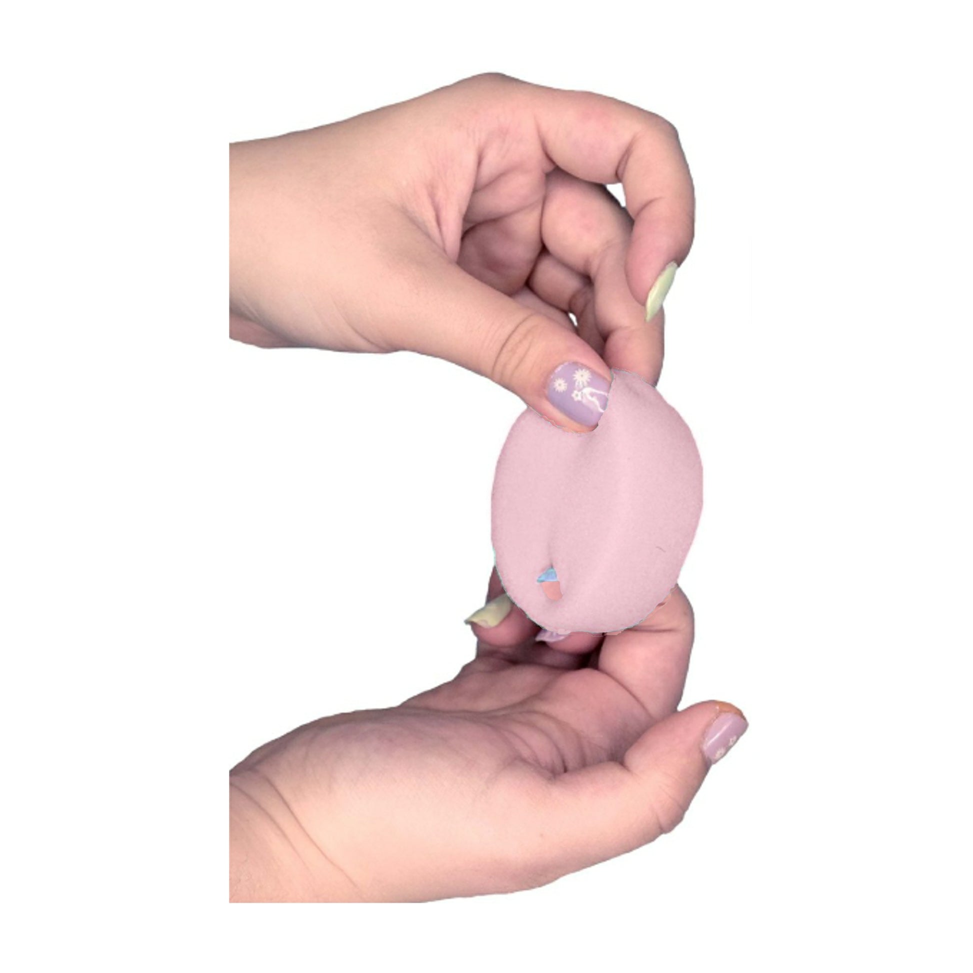 Menstrual sponge held in two hands showing retrieval loop