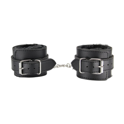 Close-up of black faux fur hand cuffs showing buckle fittings 