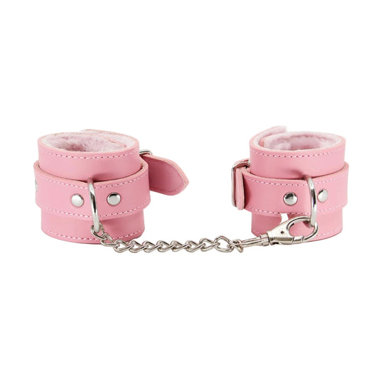 Front view of pink faux fur hand cuffs with chain attached 