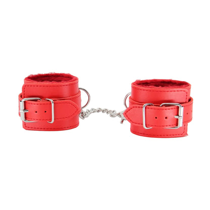 Close-up of red faux fur hand cuffs showing buckle fittings 