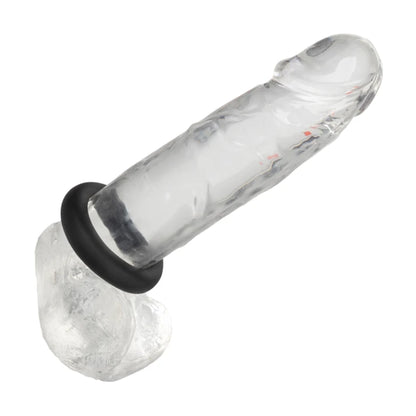 Silicone cock ring fitted onto clear dildo