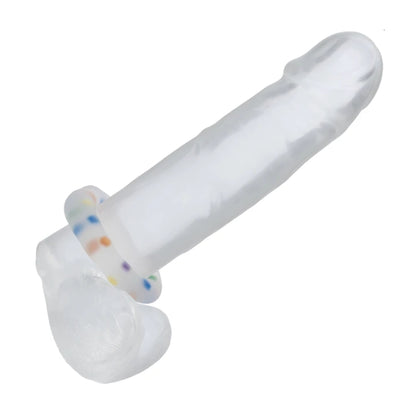 Multicolour cock ring fitted onto clear dildo