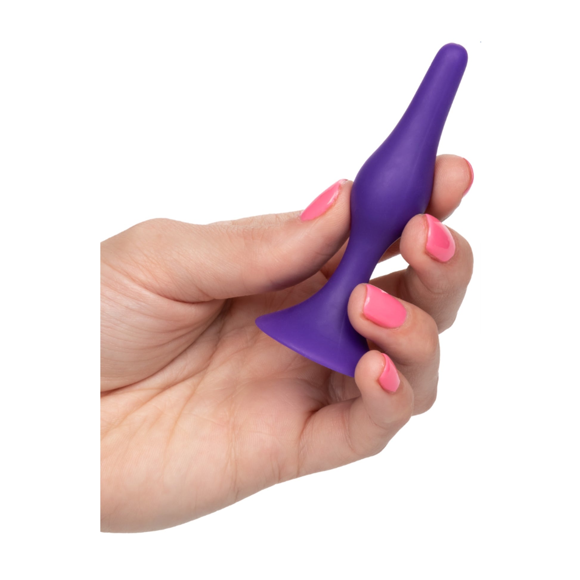 Plug held in hand to show compact size