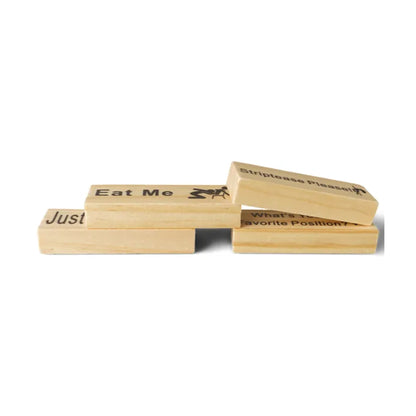 Close-up of wooden blocks with printed dares and tasks