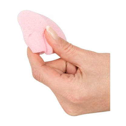 Soft tampon compressed in fingers for size reference