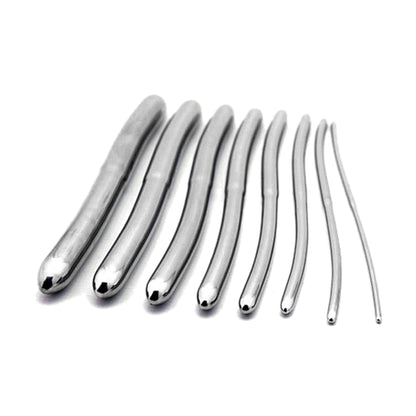 Eight polished stainless steel urethral sounds arranged from largest to smallest