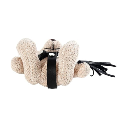 Underside view of teddy keychain showing harness detail