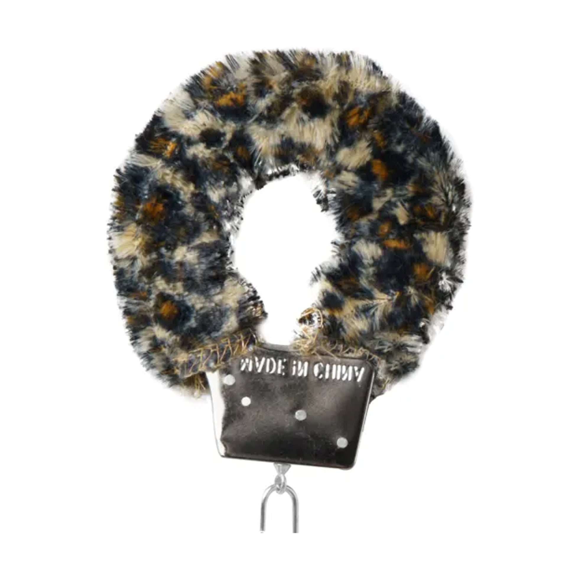 Close-up of leopard plush cuff with metal locking mechanism
