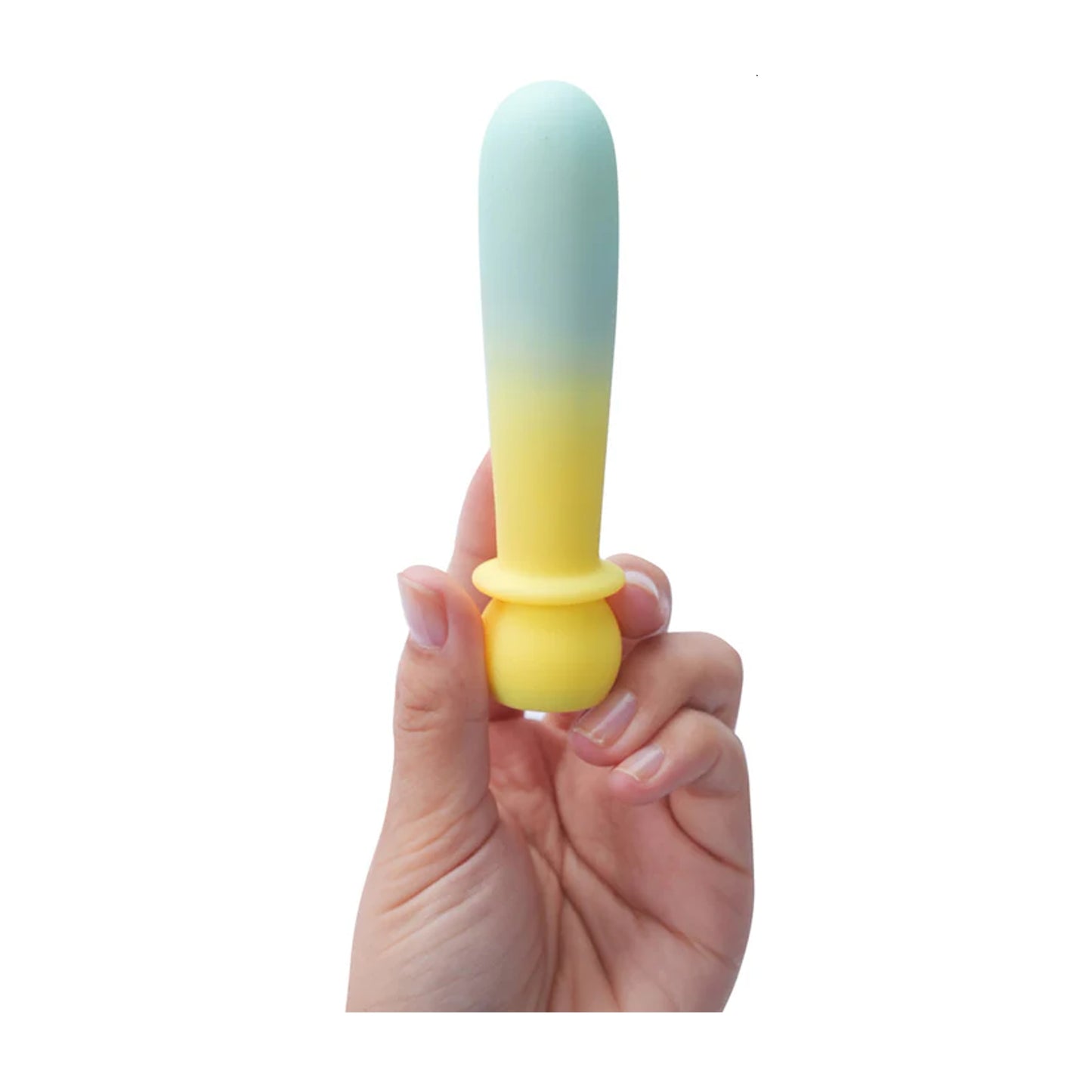 Yellow teal gradient bullet held in fingertips for scale