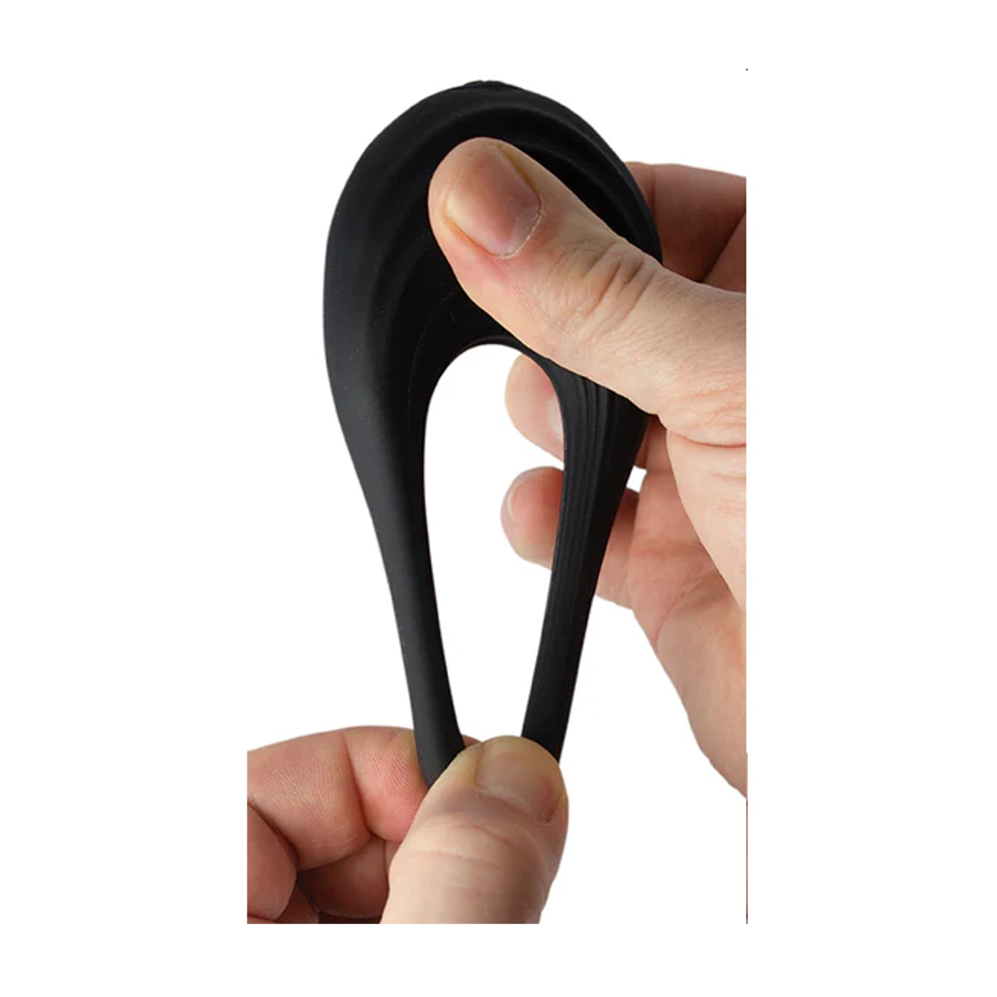 Flexible silicone cock ring being stretched by hand to show elasticity