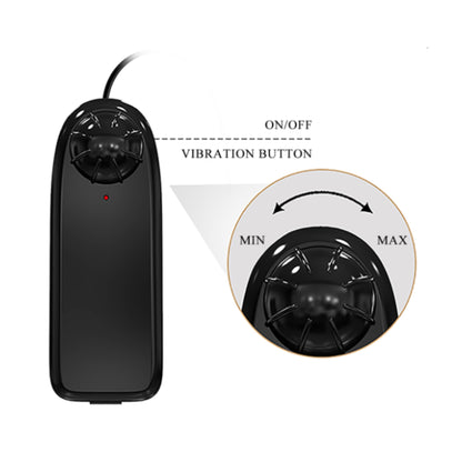 Close-up of wired remote control showing dial and indicator light