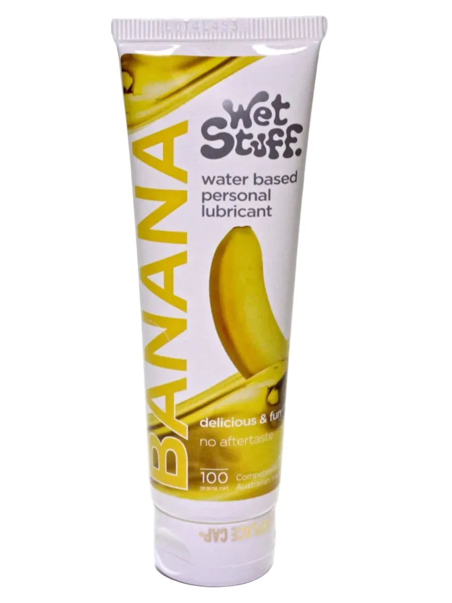 Retail packaging of Wet Stuff Banana water-based lubricant in a 100g tube, showing bright banana-themed design.
