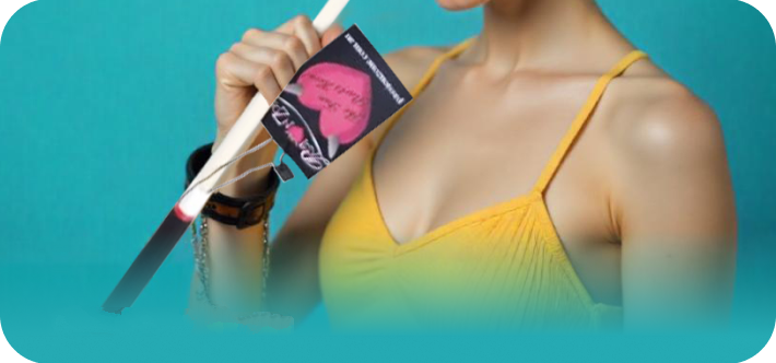 Person holding a pink and black product with a blue background