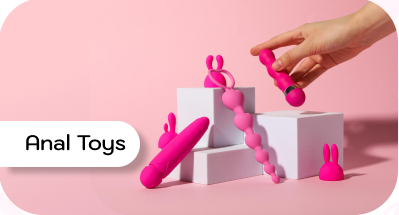 Pink anal toys on white blocks with a hand and 'Anal Toys' label on a pink background